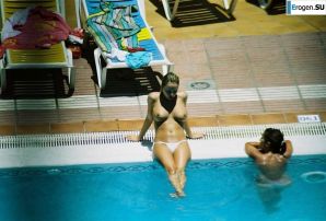 Girls sunbathe topless near the pool. Thumb 15