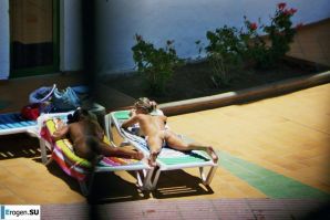 Girls sunbathe topless near the pool. Thumb 21