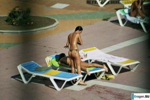 Girls sunbathe topless near the pool. Thumb 22