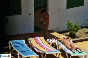 Girls sunbathe topless near the pool. Thumb 35