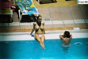 Girls sunbathe topless near the pool. Thumb 7