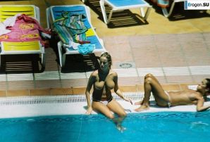Girls sunbathe topless near the pool. Thumb 9