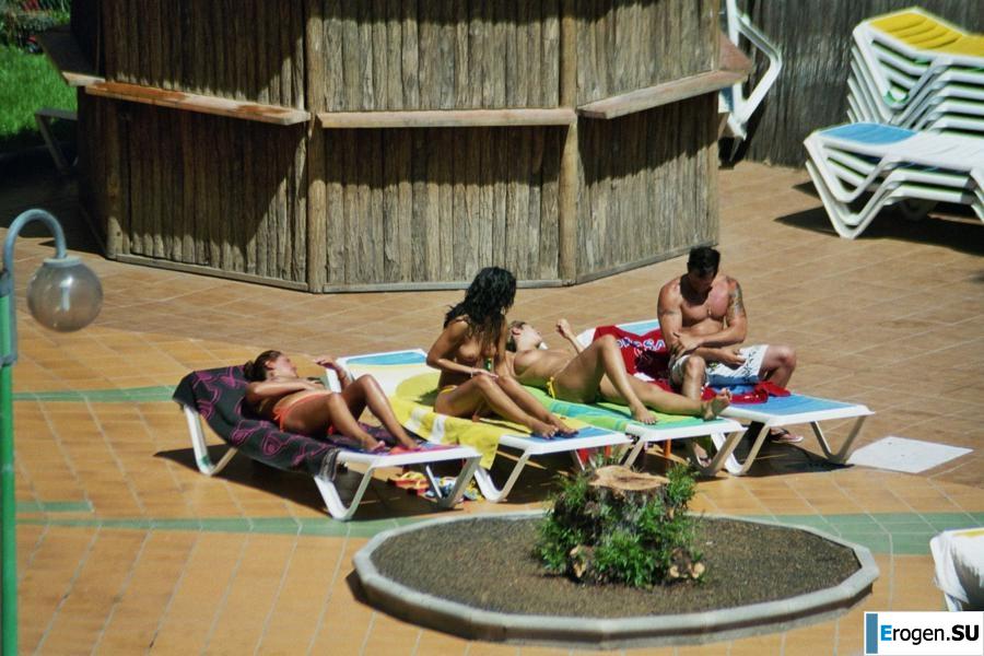 Girls sunbathe topless near the pool. Part 2. Photo 21