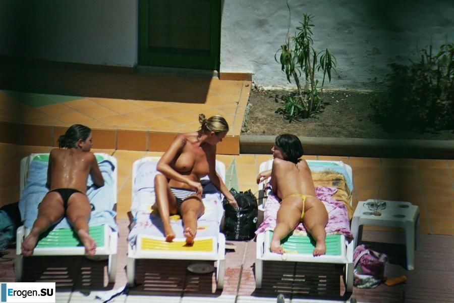 Girls sunbathe topless near the pool. Part 2. Photo 29