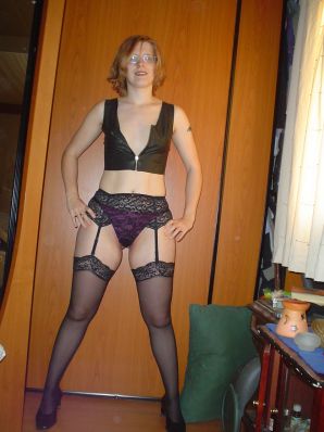 A red-haired student with glasses spread her legs in lace stockings and showed a pussy. Thumb 10