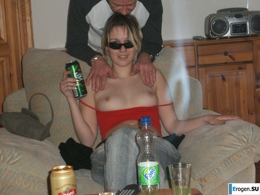 A blonde with a thin waist poses in glasses and red panties. Photo 17