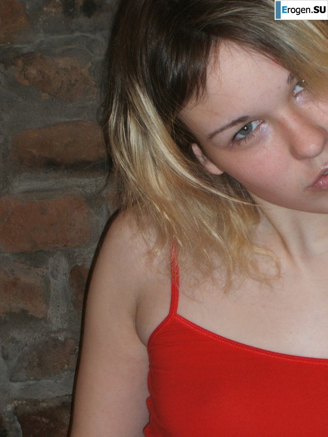 A blonde with a thin waist poses in glasses and red panties. Part 2. Photo 21