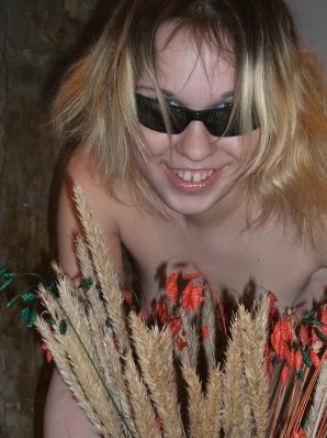 A blonde with a thin waist poses in glasses and red panties. Part 2. Thumb 12