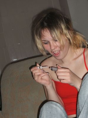 A blonde with a thin waist poses in glasses and red panties. Part 2. Thumb 16