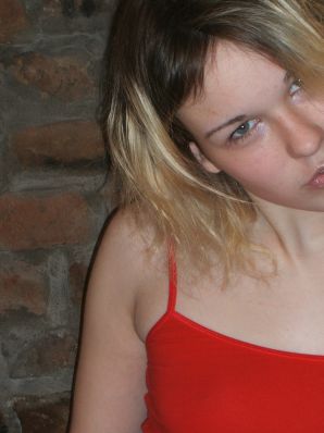 A blonde with a thin waist poses in glasses and red panties. Part 2. Thumb 21
