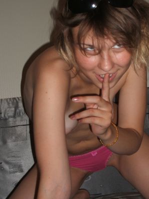 A blonde with a thin waist poses in glasses and red panties. Part 2. Thumb 30