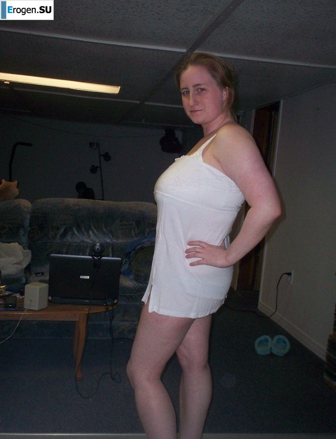 Busty woman posing in short dresses. Photo 19