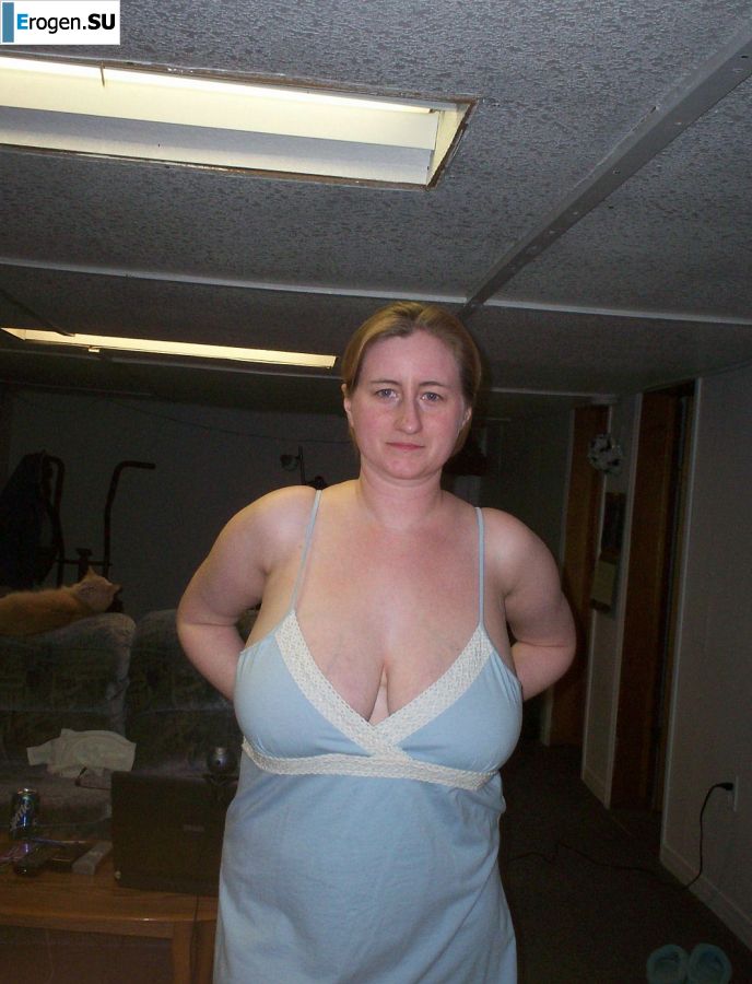 Busty woman posing in short dresses. Photo 22