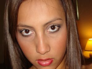 A woman with beautiful tits poses in a swimsuit and without him. Thumb 6