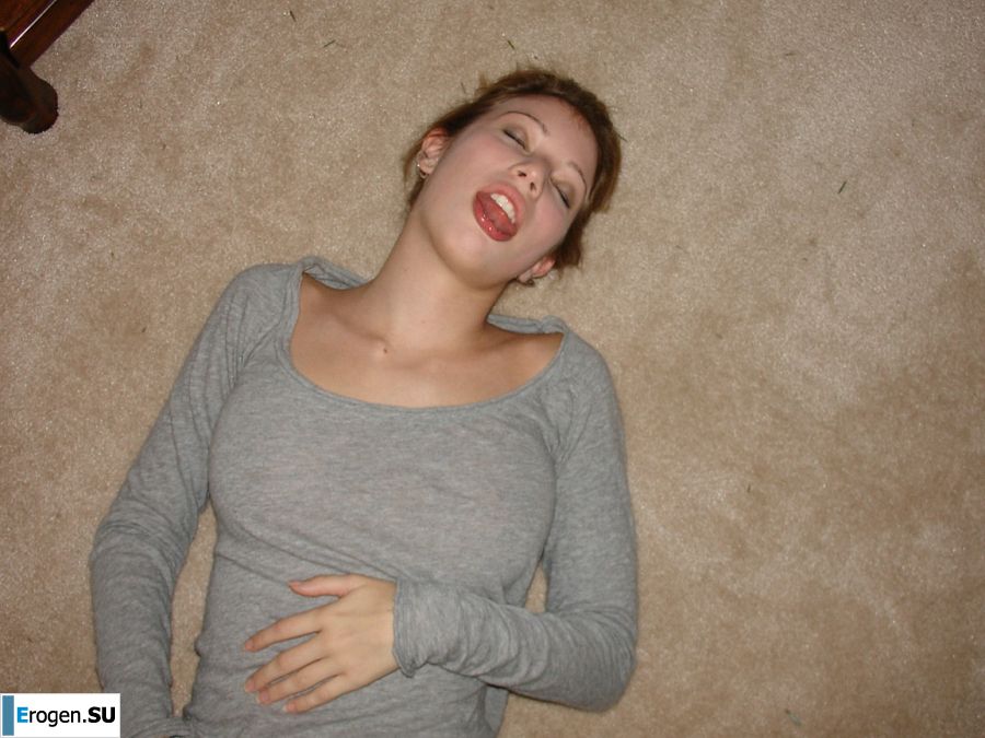 A young girl spread her legs and fingers her wet labia with her fingers. Photo 10