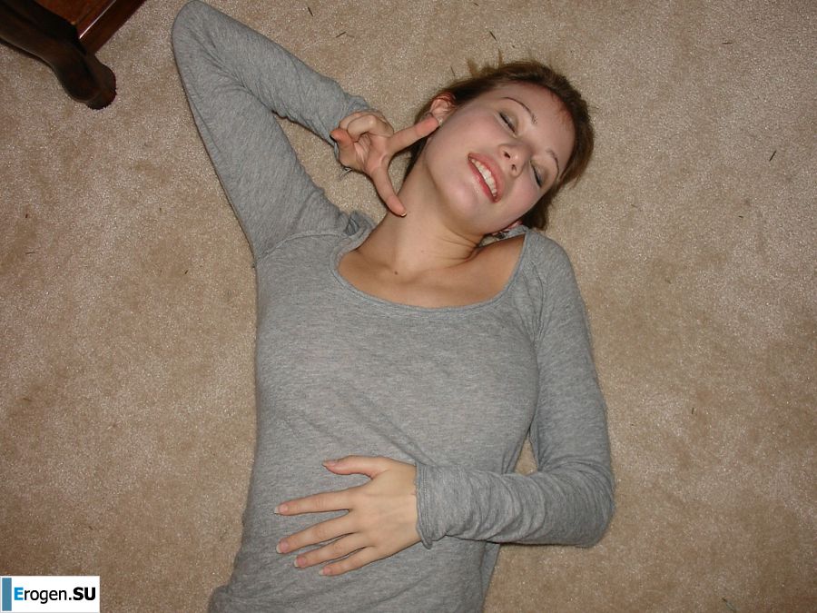 A young girl spread her legs and fingers her wet labia with her fingers. Photo 11