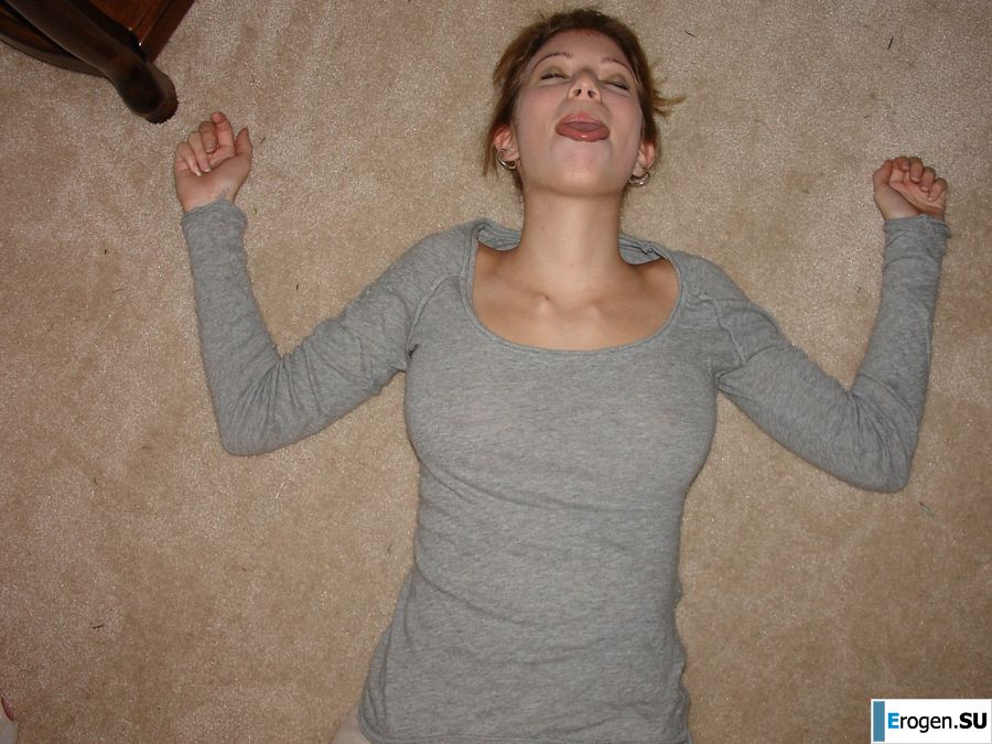 A young girl spread her legs and fingers her wet labia with her fingers. Photo 7
