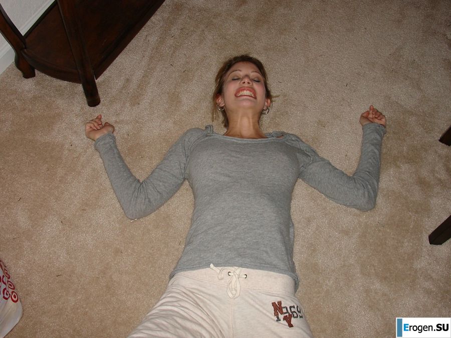 A young girl spread her legs and fingers her wet labia with her fingers. Photo 8