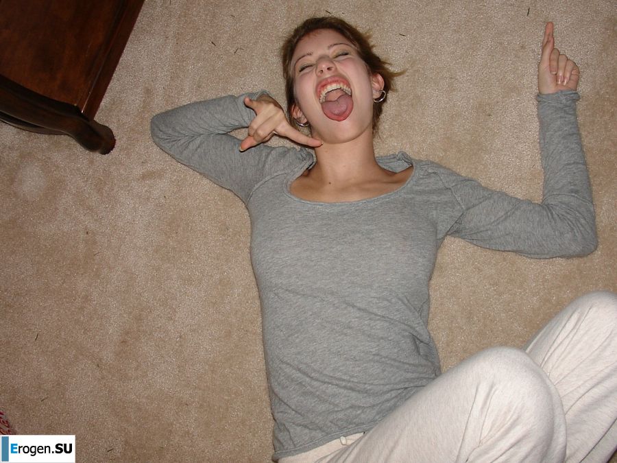 A young girl spread her legs and fingers her wet labia with her fingers. Photo 9
